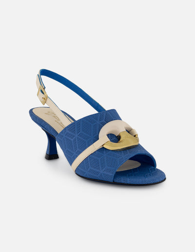 Mule azul en piel grabada con adorno circular bicolor para mujer