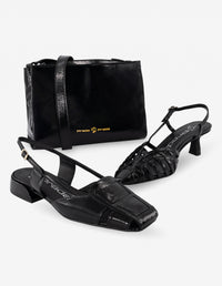 Flat destalonado de charol en color negro para mujer