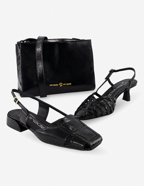 Flat destalonado de charol en color negro para mujer