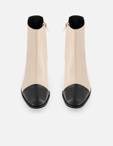 Botines blancos piel de mujer con punta y tacón negros