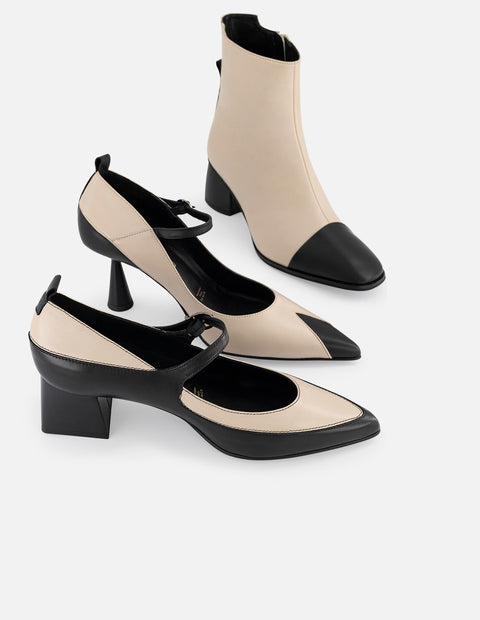 Botines blancos piel de mujer con punta y tacón negros