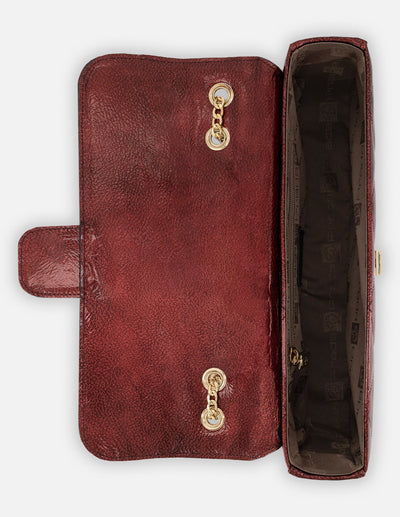 Satchel rojo charol para mujer con acabado capitonado