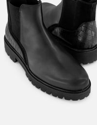 Botines Chelsea negros de piel tipo coco para hombre con suela ligera