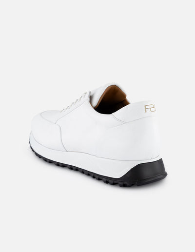Tenis color blanco en piel con suela deportiva para hombre