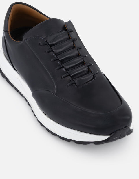 Tenis color gris en piel con suela deportiva para hombre