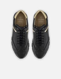 Tenis negro con ribete colro dorado en piel para hombre