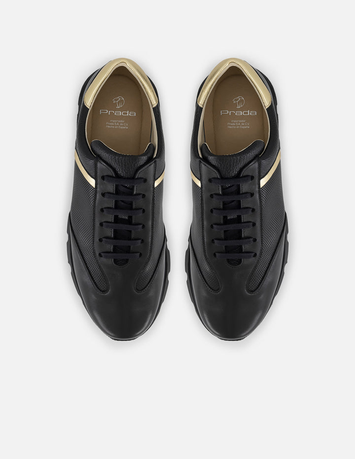 Tenis negro con ribete colro dorado en piel para hombre