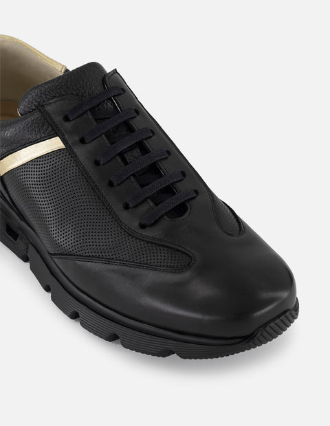 Tenis negro con ribete colro dorado en piel para hombre