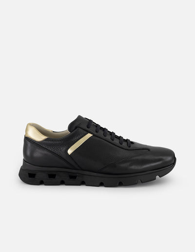Tenis negro con ribete colro dorado en piel para hombre