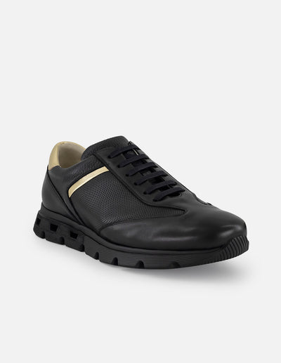 Tenis negro con ribete colro dorado en piel para hombre