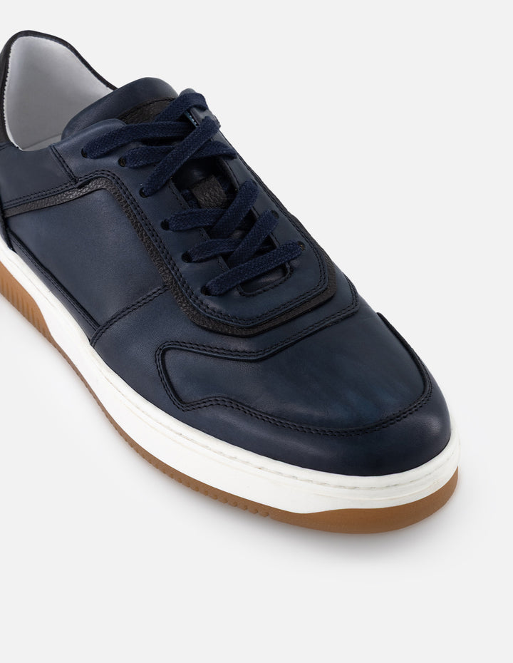 Tenis color azul en piel para hombre