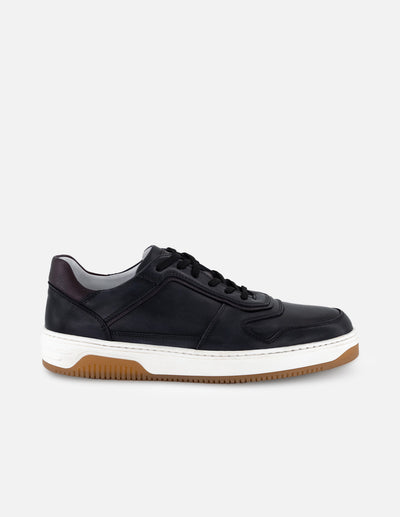 Tenis color negro en piel para hombre