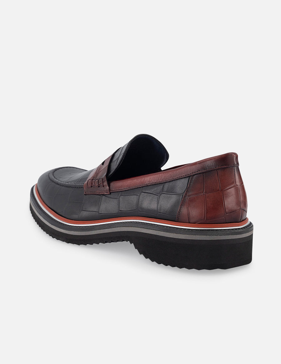 Mocasín en piel con grabado tipo coco en color vino para hombre