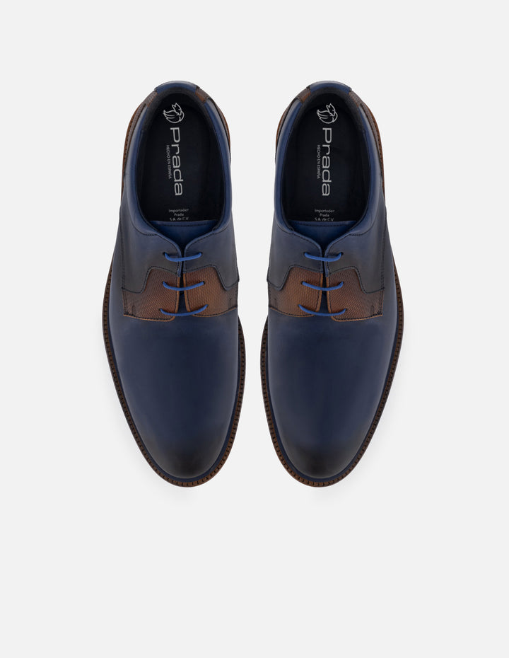 Blucher en piel napa color azul marino con detalles azules y sombreado a mano para hombre