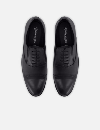 Zapato Oxford en piel napa color negro con puntera para hombre