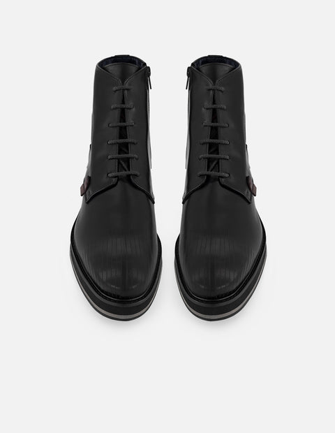 Botines negros en piel para hombre detalle tipo coco color rojo