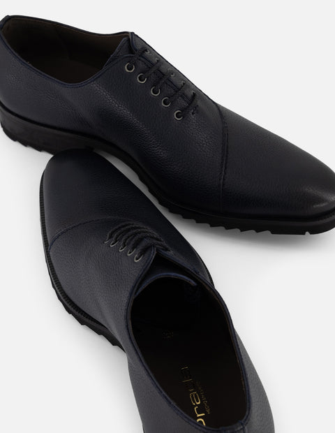 Zapato Oxford azul piel para hombre con corte asimétrico