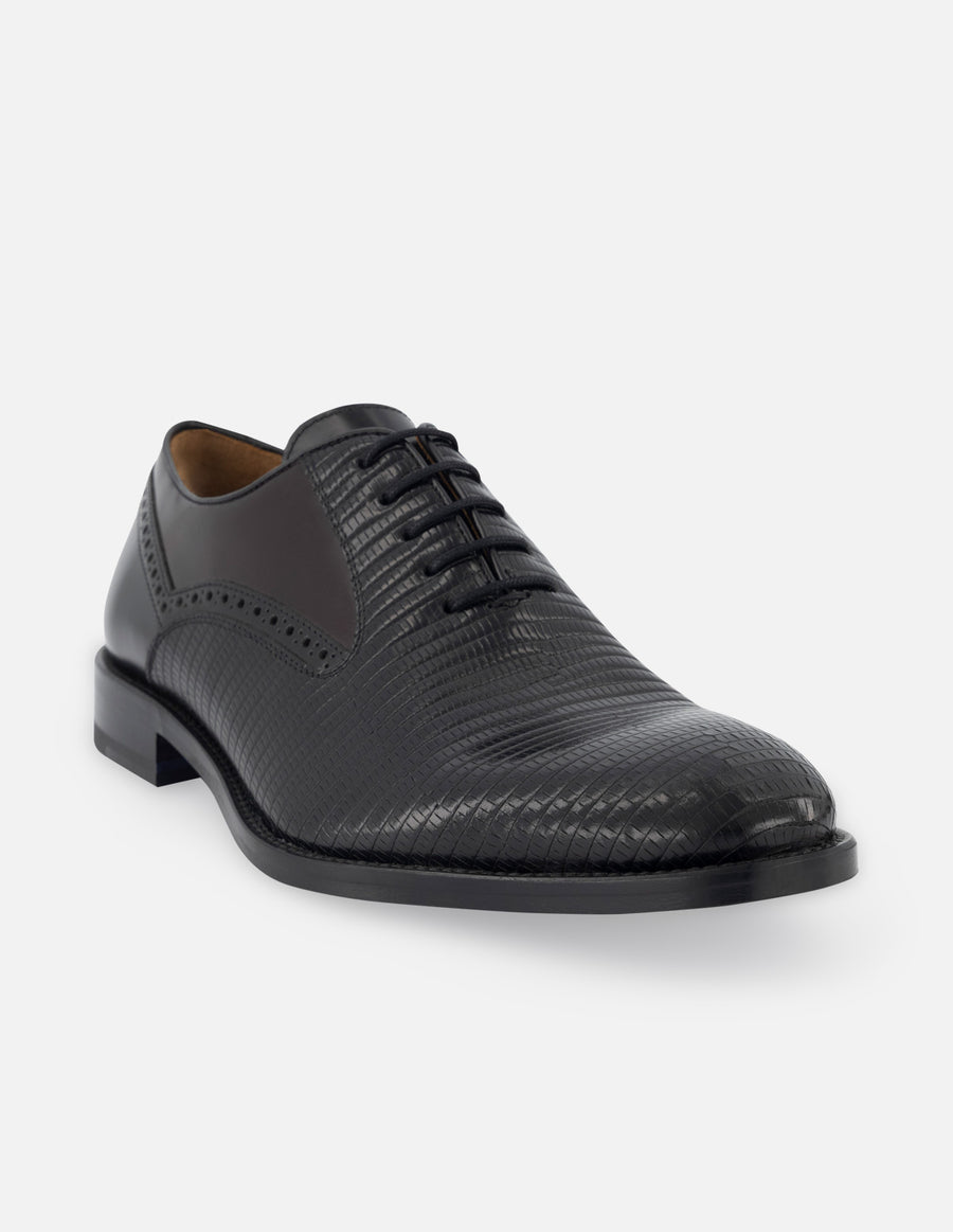 Oxford de piel color negro con detalles en grabado tipo tejus y florantik para hombre.