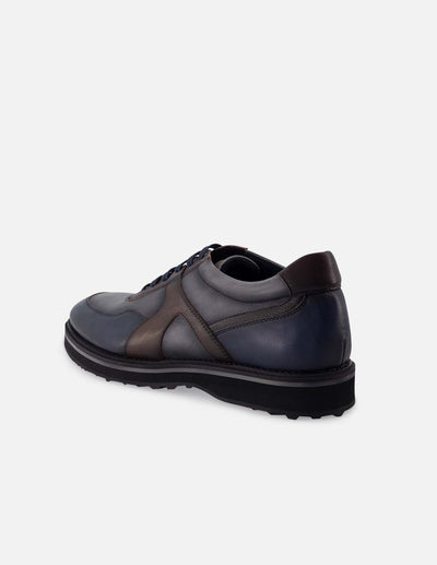 Blucher en piel napa color gris con bloques de color y detalles de sombreado para hombre