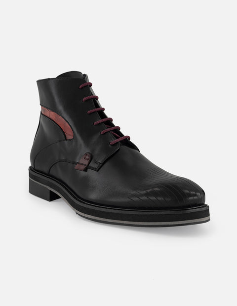 Botines negros de piel para hombre con detalle tipo coco
