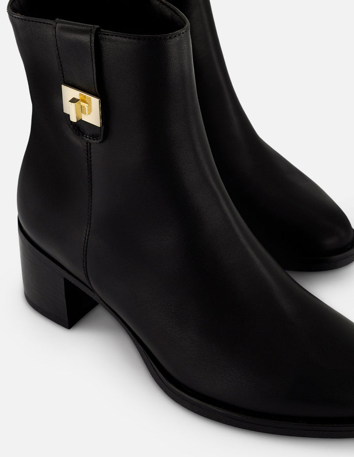 Botines negro piel para mujer con tira lateral