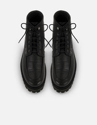 Botines negros de piel grabada tipo tejus para hombre con suela tipo combate