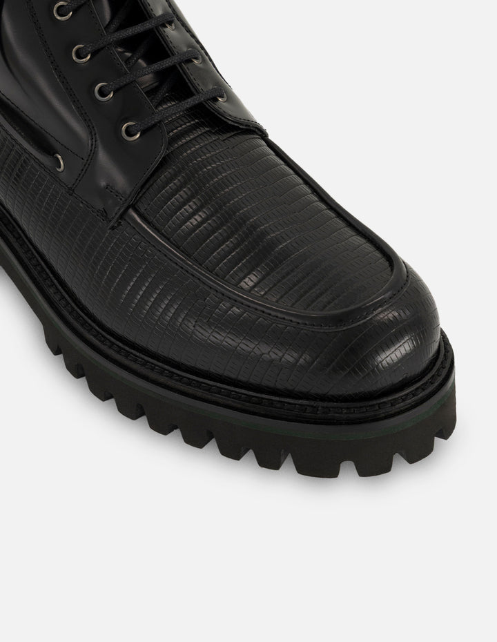 Botines negros de piel grabada tipo tejus para hombre con suela tipo combate