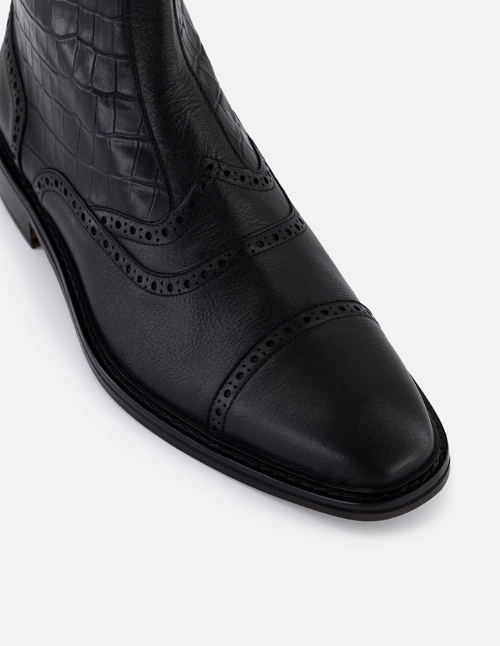 Botines negros en piel tipo coco para hombre con detalles en picado