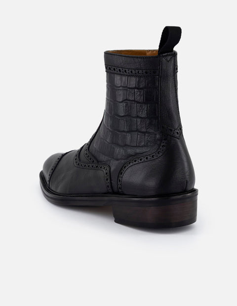 Botines negros en piel tipo coco para hombre con detalles en picado