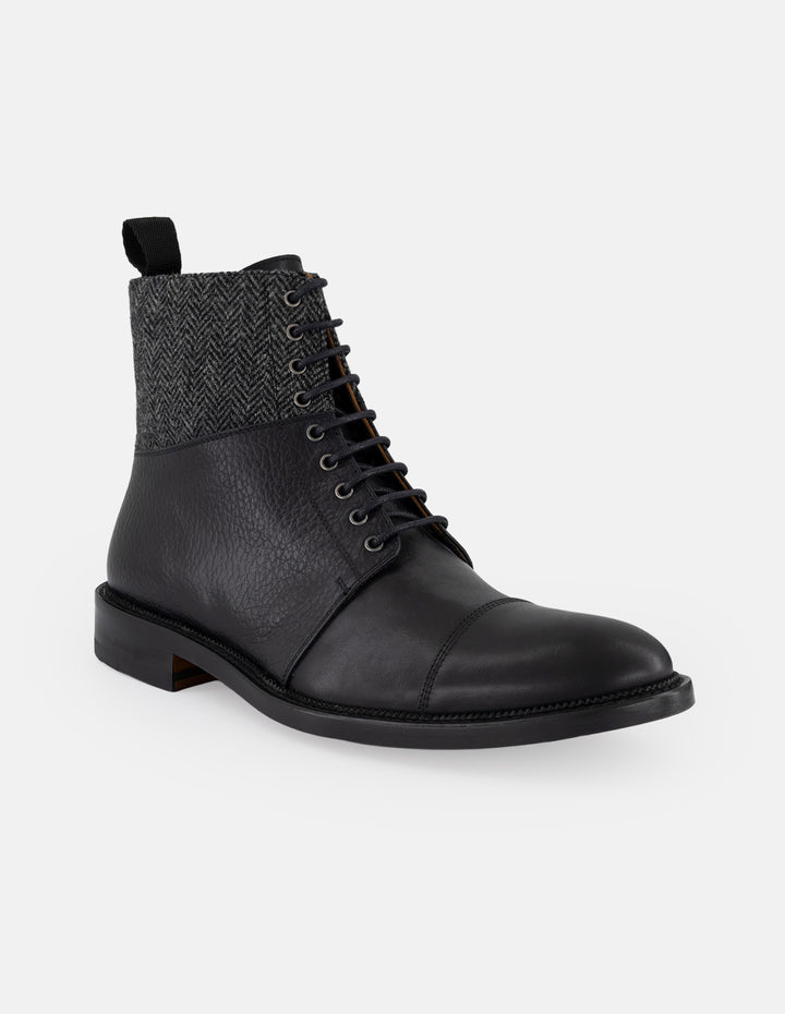 Botines negros piel y textil para hombre con caña tipo espiga