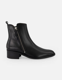 Botines negros de piel para mujer con corte asimétrico