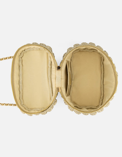Minibolso color dorado vegano para mujer con diseño capitonado
