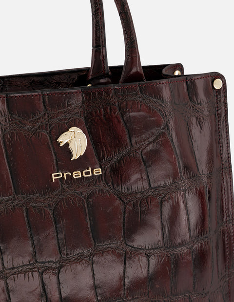 Bolso de mano vino piel tipo coco para mujer con logo frontal