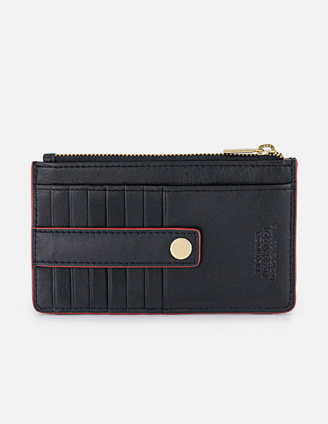 Monedero para mujer con detalles rojos y placa Pd